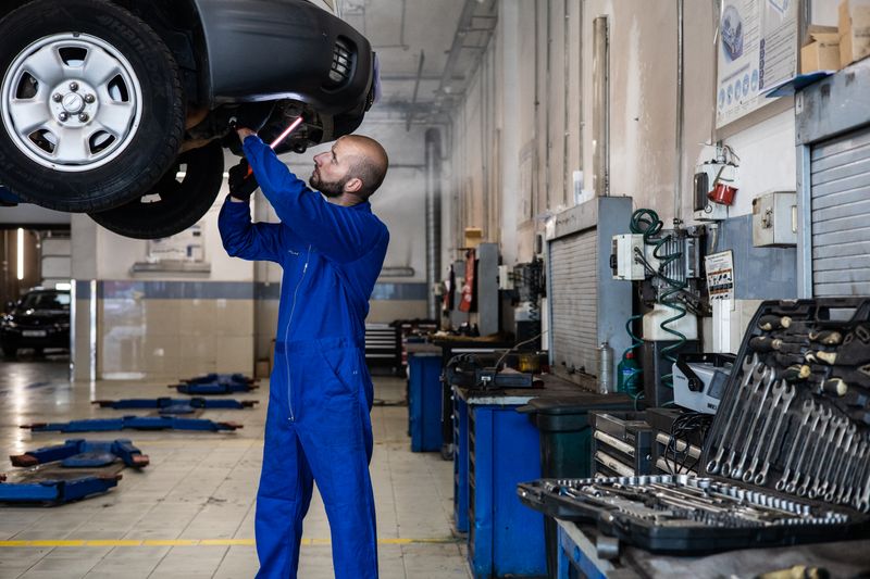 a mechanic working on a car